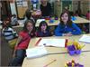 4th Graders enjoy reading poetry to their kindergarten friends. 